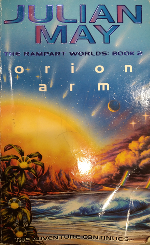Cover of Orion Arm by Julian May. A large sun or explosion expands in the distance surrounded by jagged, barren mountains. The point of view is from the shore of a beach. The seas are stormy and beams of rainbow shoot from storm clouds like lightning. Plants with odd orb-like centers are in the foreground.