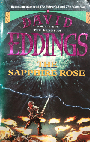 Cover of The Sapphire Rose by David Eddings. A knight holding a sword toward a light void sucking in light in ripple shapes. Torches of flame surround him and a single bolt of lightning crosses diagonally and hits the very tip of the sword..