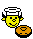 Yellow smilie face flipping a pancake in a frying pan
